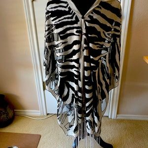 Beautiful shawl/scarf that can be worn 7 ways.